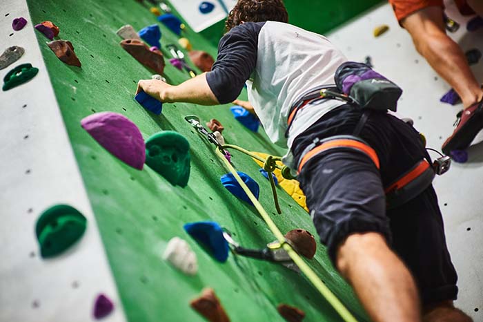 Student on climbing wall