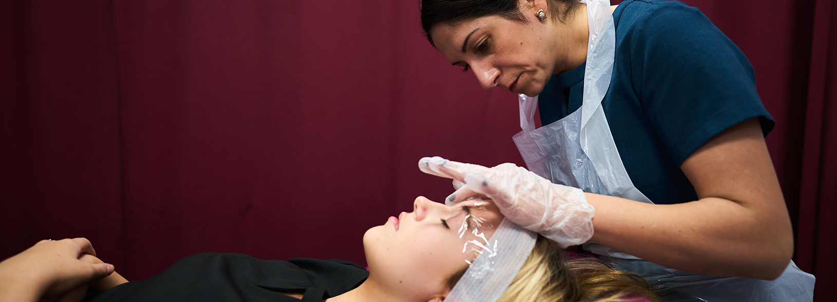 beauty student doing a client's eyebrows