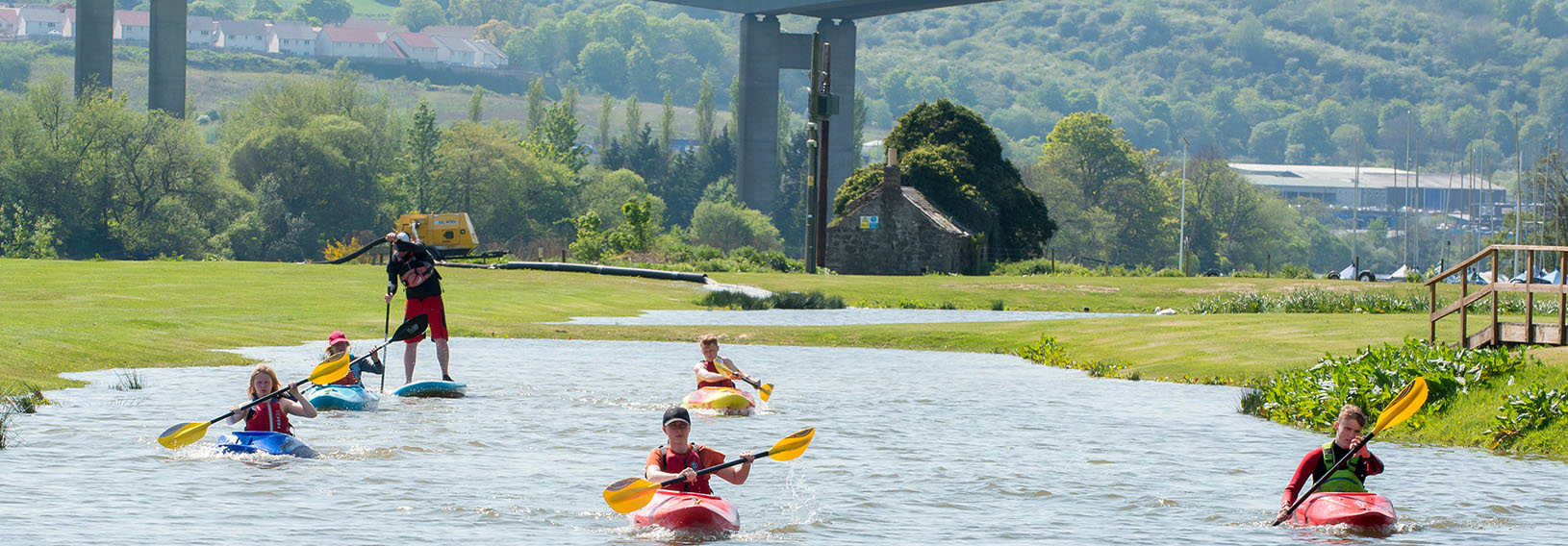 students canoeing out on the water