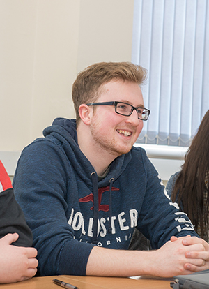 Smiling student sitting in class