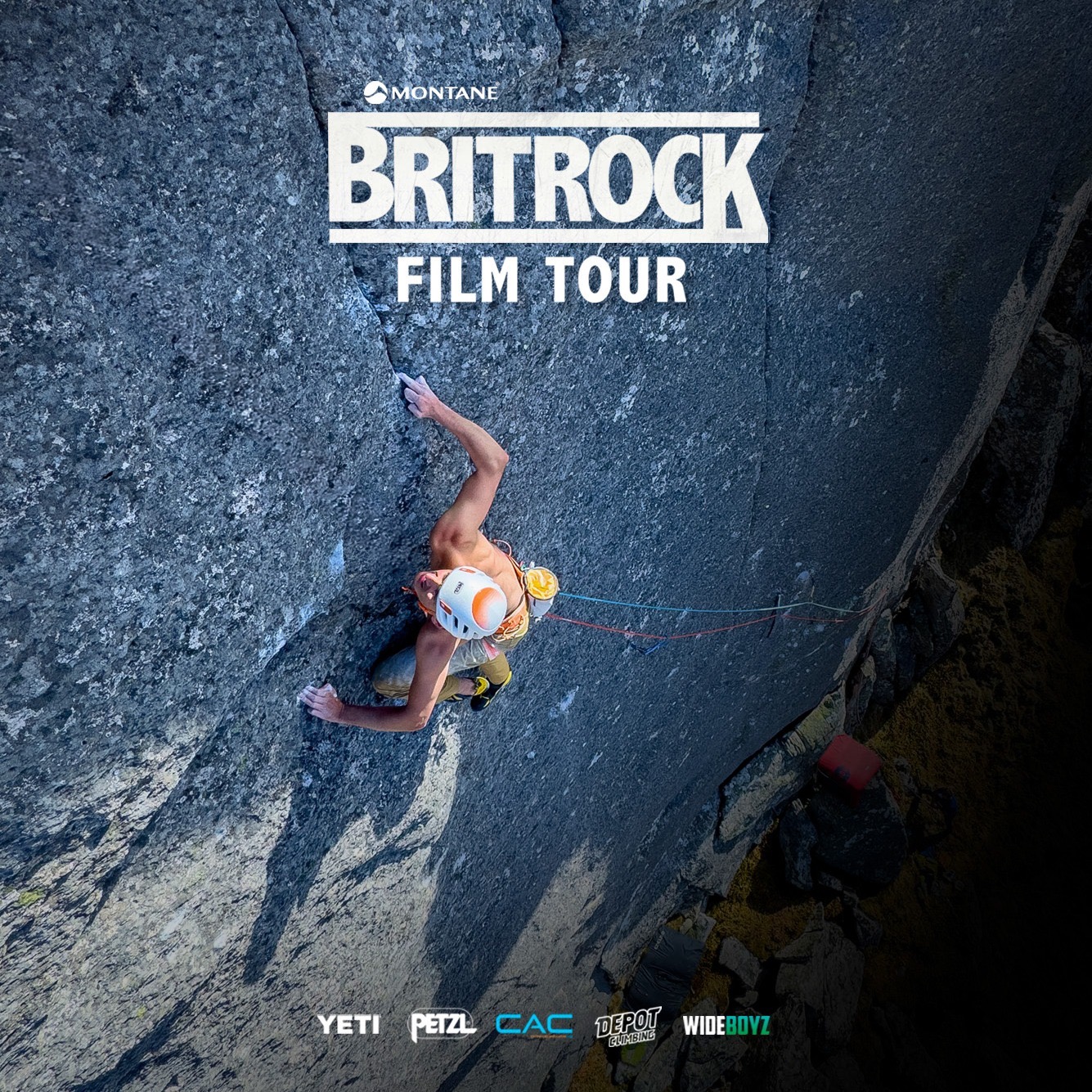 Person climbing the side of a steep mountain