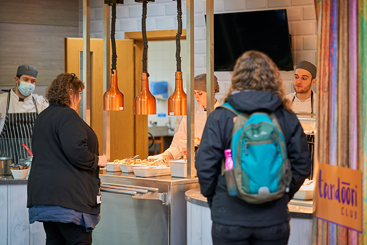 2 students at the counter in the food court