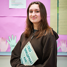 student standing in the early years classroom