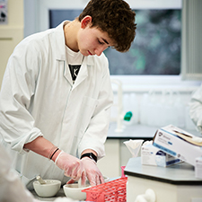 student in a science lab