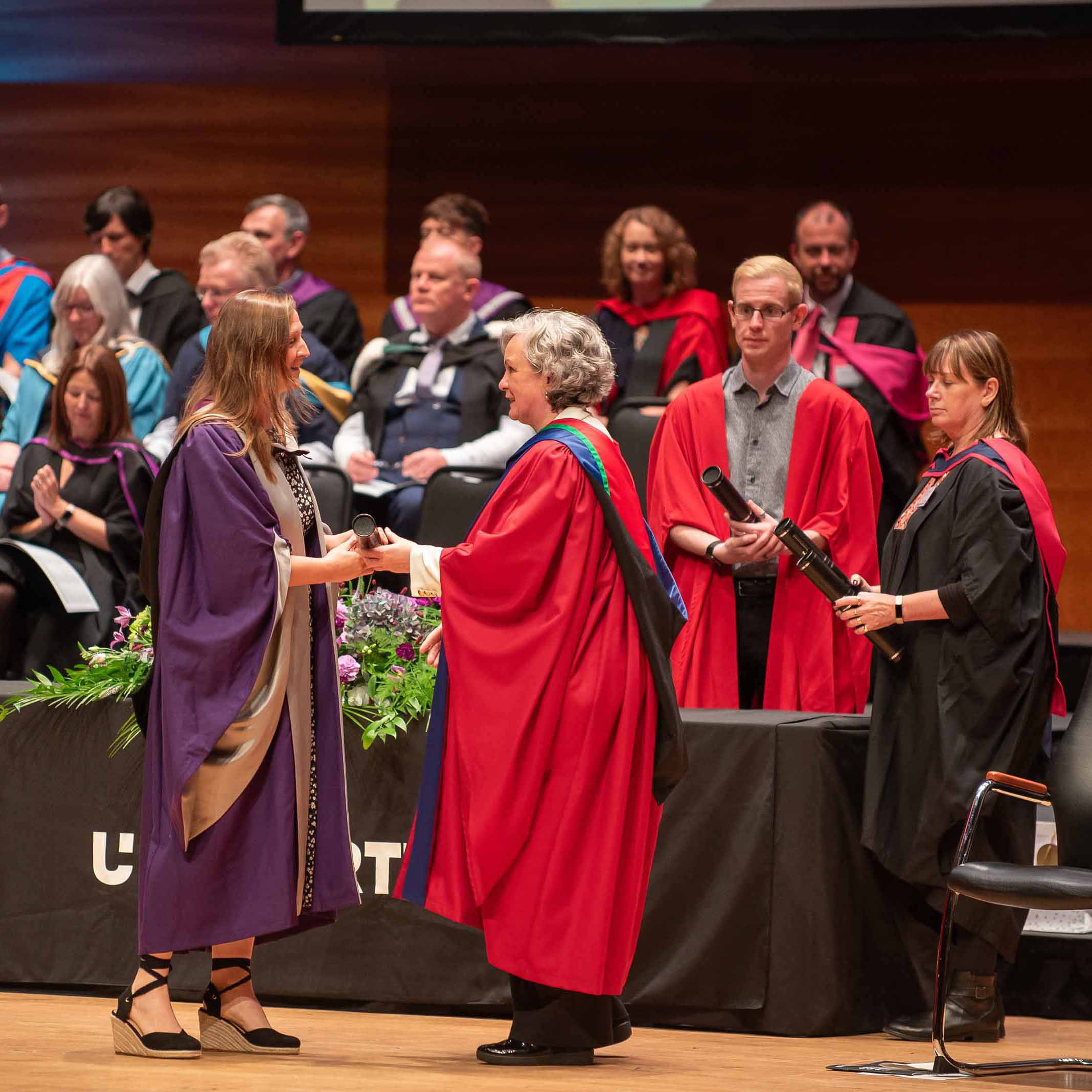 student receiving award on stage