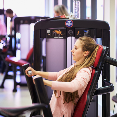 student using gym machine