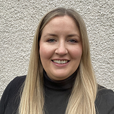 selfie of paula against a wall