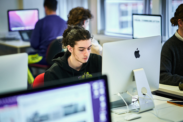 student on an imac