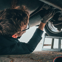 person working under car