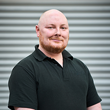 scott standing in workshop