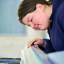 rebecca in the motor vehicle workshop