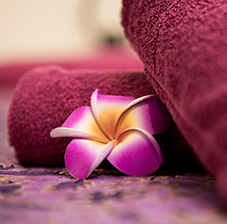 a flower beside a towel