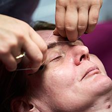 eyebrows being threaded