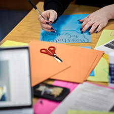 bits of paper and scissors on a table