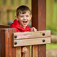 children playing outside in nursery garden