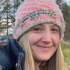 lindsay outside wearing a hat