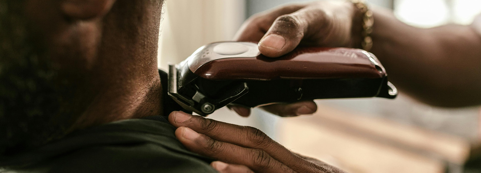 Person having their hair cut using clippers