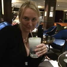 magda with a drink in a glass
