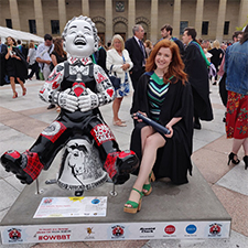 Sarah outside the caird hall after graduation
