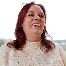 anna wearing a cream jumper