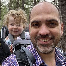 scott with his daughter on a walk