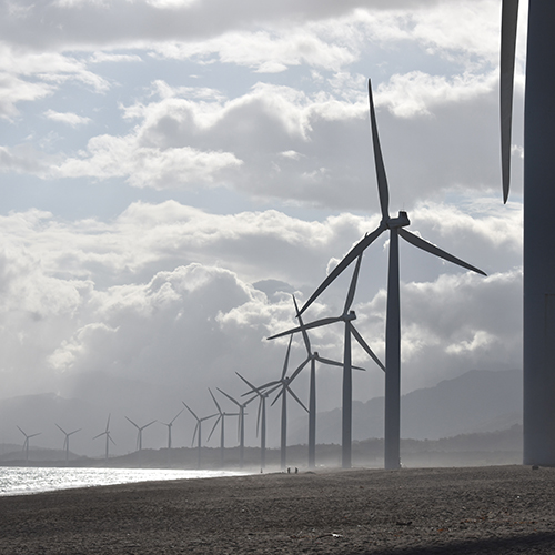 wind turbines on a beach
