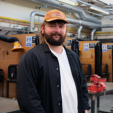 kieran standing in the engineering workshop on campus