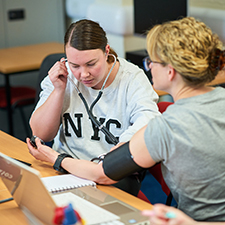 students in the classroom using healthcare equipment