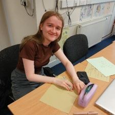 leah in a classroom at a desk