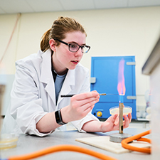 two students doing an experiment