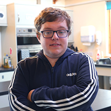 mckenzie in a navy jumper in the classroom
