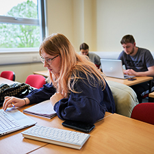 student working on a laptop