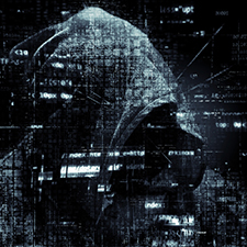 cyber hacker with a blanket over their head with computer text in the background