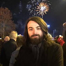 lewis outside at a bonfire display