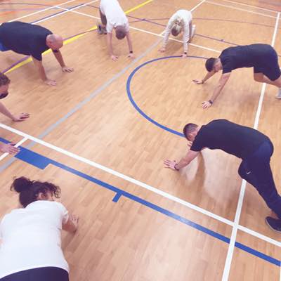 A group of students in a press up position