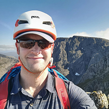 kieran in a hat on a mountain