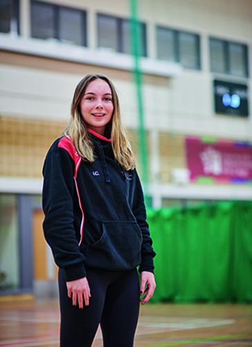 sport and fitness student, iona, standing in the gym hall